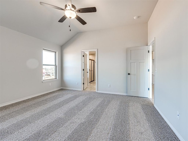 unfurnished bedroom with ceiling fan, light carpet, and lofted ceiling