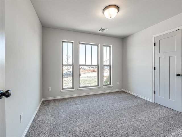 view of carpeted spare room