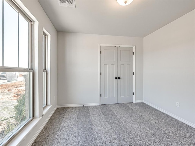 unfurnished room with carpet floors