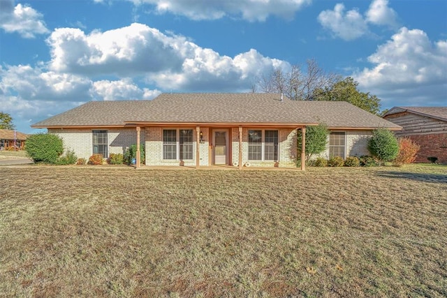 ranch-style home featuring a front yard