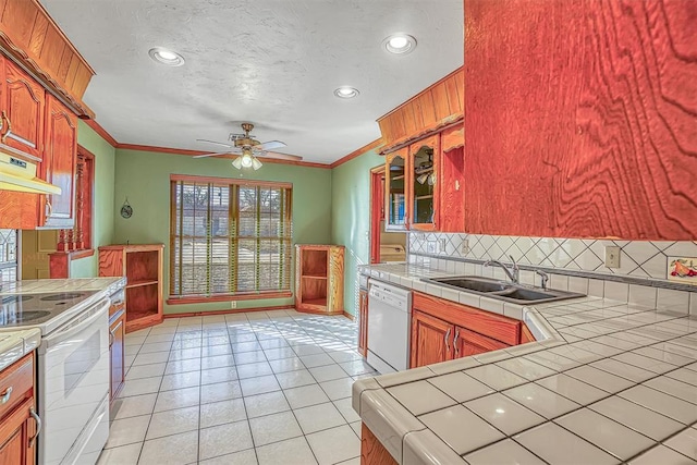 kitchen featuring tile counters, light tile patterned flooring, white appliances, and sink