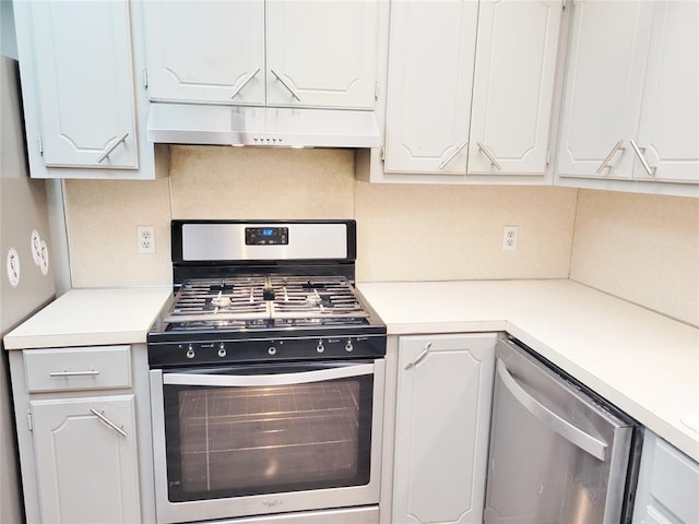 kitchen with stainless steel appliances, backsplash, and white cabinetry