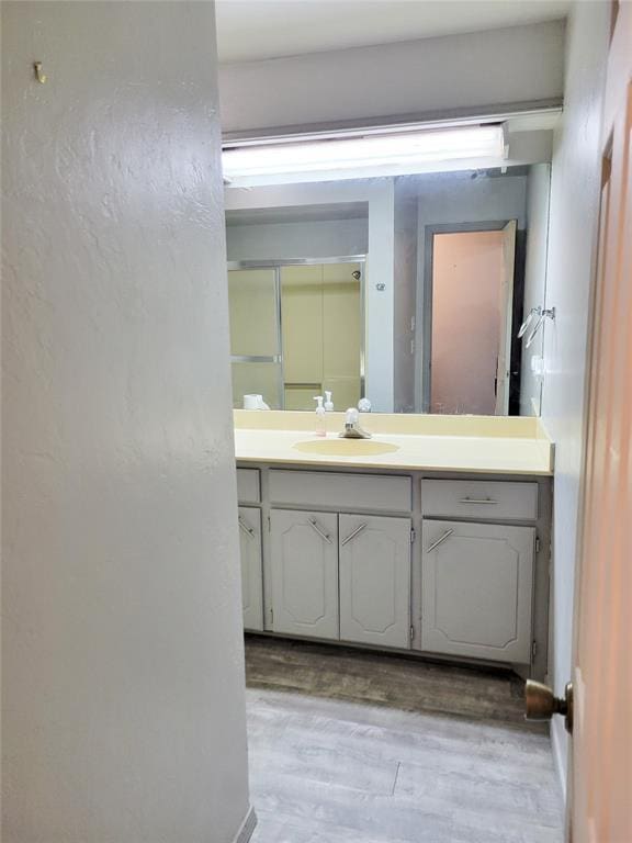 bathroom featuring hardwood / wood-style floors and vanity