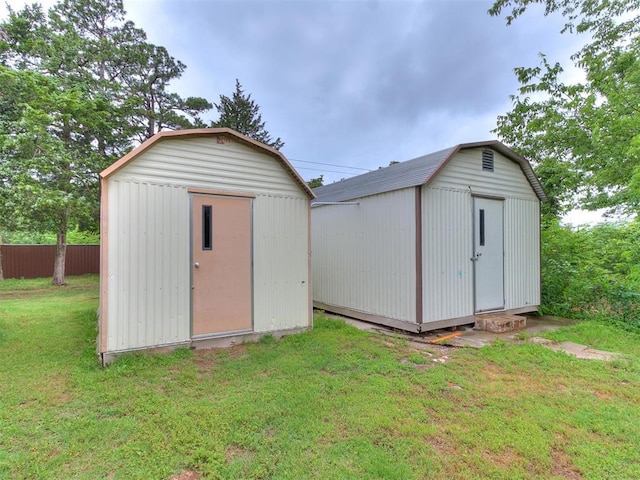 view of outbuilding featuring a yard