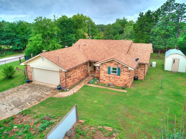 ranch-style home with a garage, a front lawn, and a shed