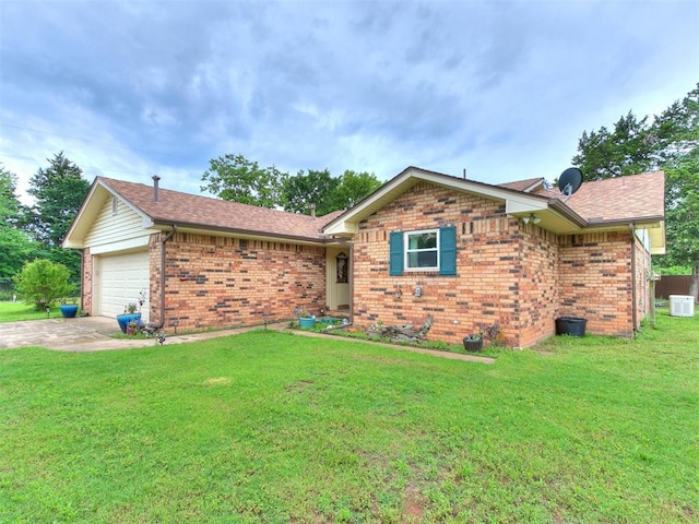 ranch-style home featuring a front lawn and a garage