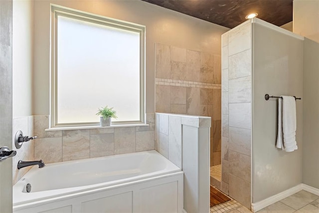 bathroom with tile patterned floors and plus walk in shower