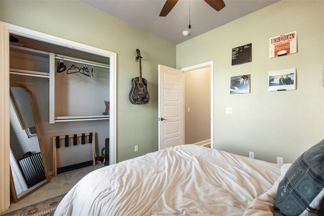 carpeted bedroom with ceiling fan and a closet