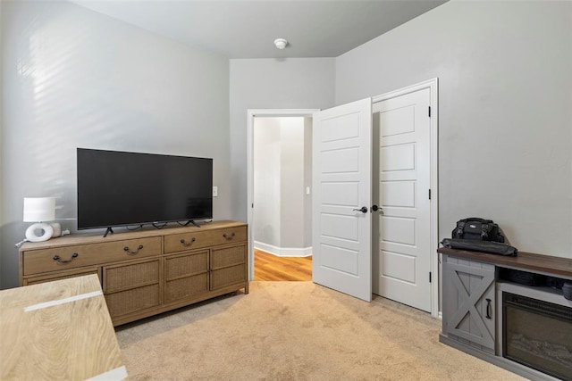 bedroom featuring light carpet