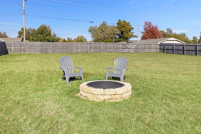 view of yard with a fire pit