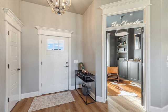 foyer featuring a notable chandelier and light wood-type flooring