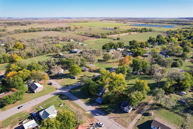 drone / aerial view featuring a water view and a rural view