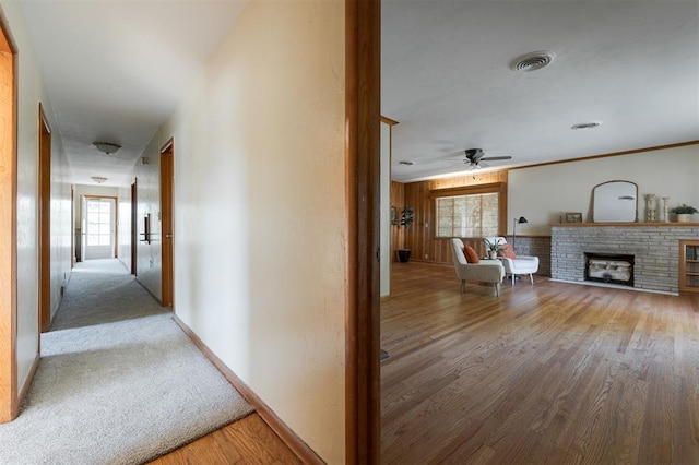 hall with hardwood / wood-style flooring