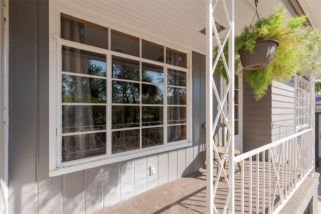 view of side of home with a porch