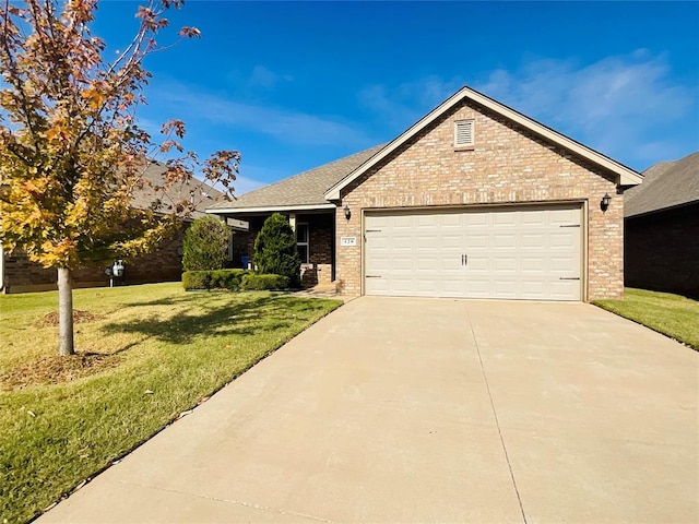 view of front of home with a garage and a front lawn