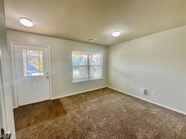 view of carpeted entrance foyer