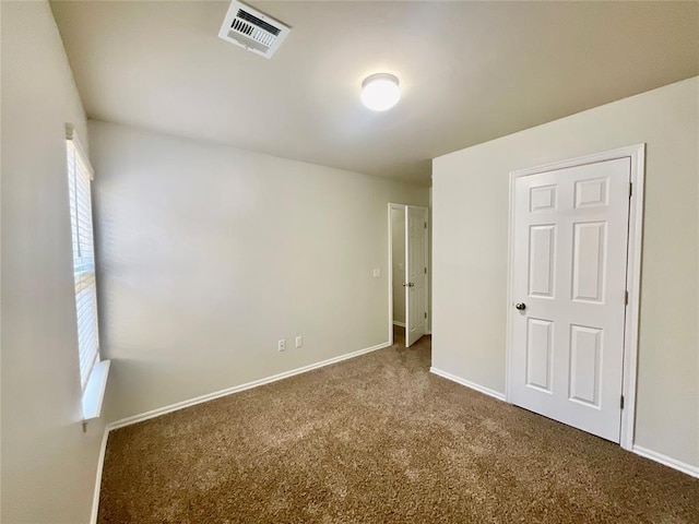 empty room featuring carpet floors