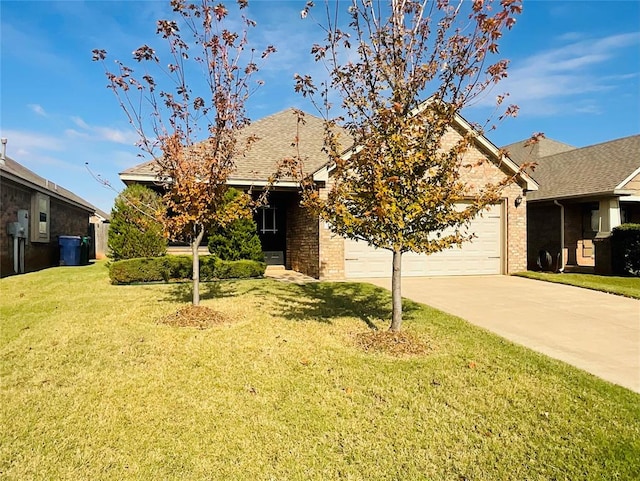 obstructed view of property featuring a garage and a front lawn