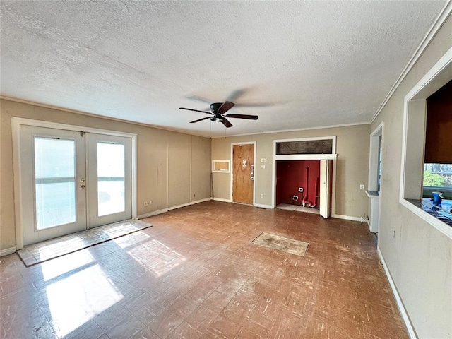 unfurnished living room featuring french doors, a textured ceiling, and plenty of natural light