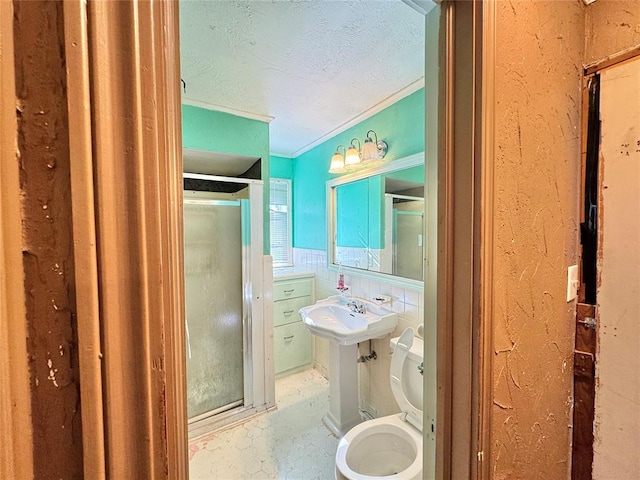 bathroom with toilet, ornamental molding, and sink