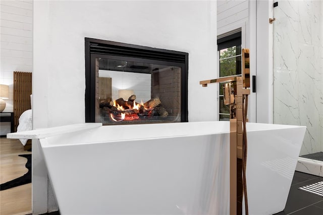 details featuring a multi sided fireplace