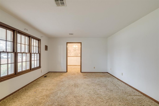 empty room with light colored carpet