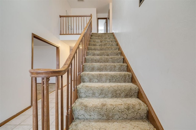 staircase with tile patterned flooring