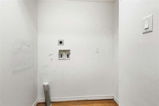 laundry room featuring hookup for a washing machine, hardwood / wood-style floors, and hookup for an electric dryer