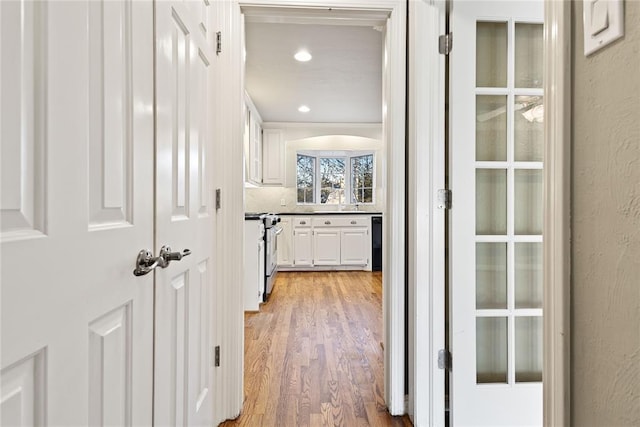 corridor featuring hardwood / wood-style floors