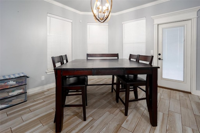 dining area with a chandelier, light hardwood / wood-style floors, and ornamental molding