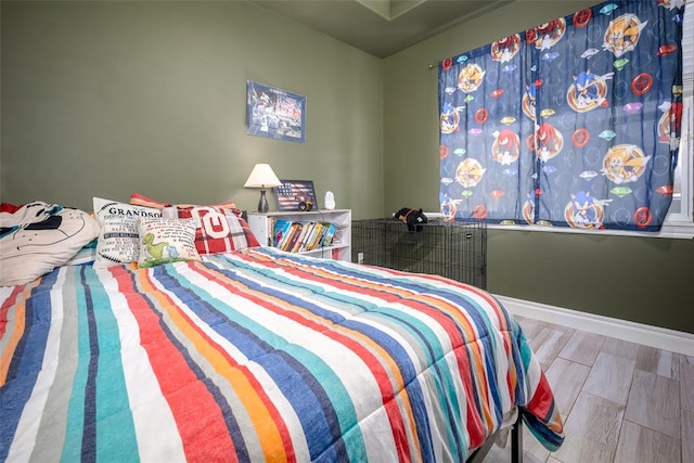 bedroom with wood-type flooring