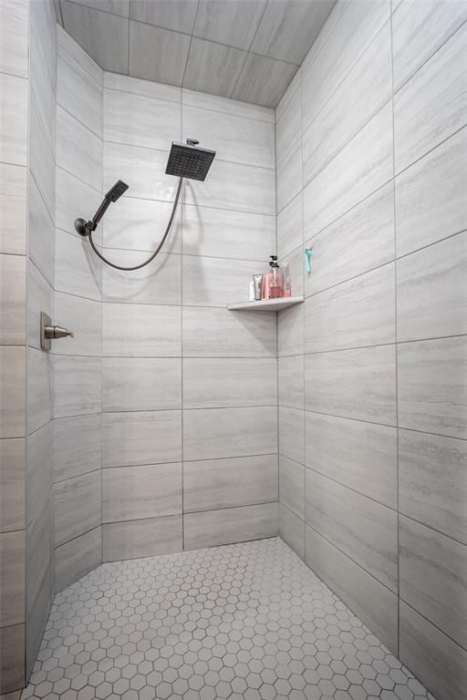 bathroom with tiled shower