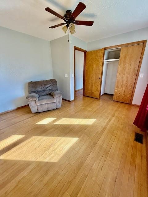 interior space featuring ceiling fan and light hardwood / wood-style flooring