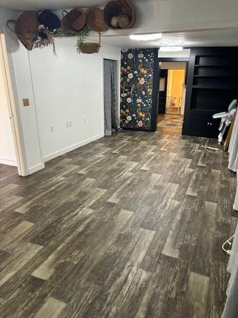 unfurnished living room with dark hardwood / wood-style floors