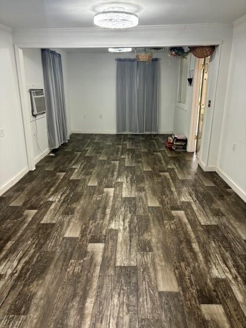 unfurnished room featuring dark hardwood / wood-style floors and ornamental molding