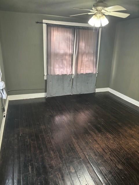 empty room featuring ceiling fan and wood-type flooring