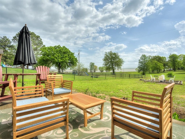 view of property's community with a lawn and a rural view