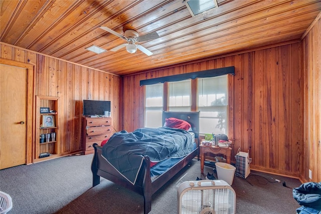 bedroom featuring carpet flooring, ceiling fan, wooden walls, and wood ceiling