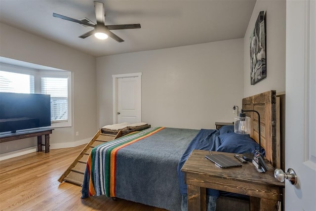 bedroom featuring ceiling fan and hardwood / wood-style floors