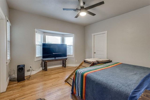 bedroom featuring hardwood / wood-style floors and ceiling fan