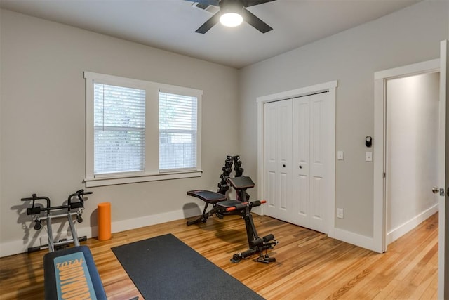 workout room featuring ceiling fan and hardwood / wood-style floors