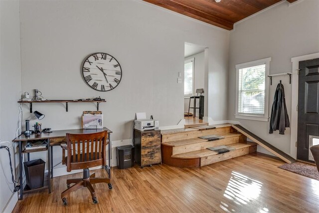 office area featuring light wood-type flooring and wooden ceiling