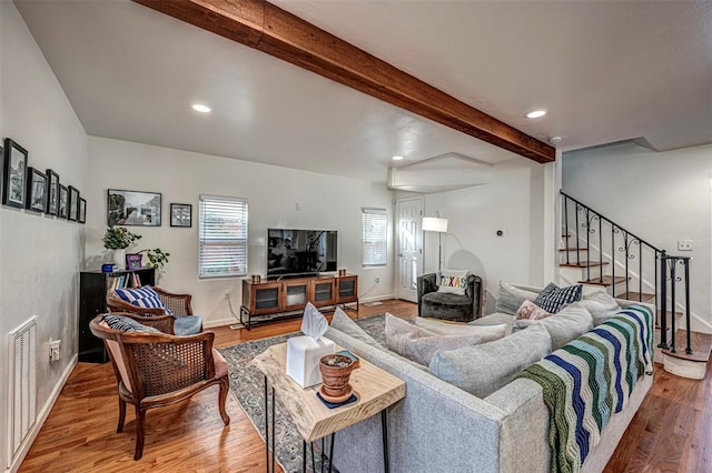 living room with hardwood / wood-style flooring and beamed ceiling