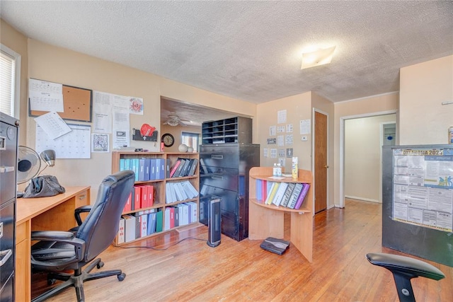 office featuring hardwood / wood-style floors and a textured ceiling