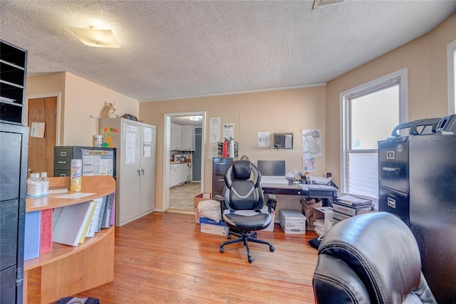 office space featuring a textured ceiling and hardwood / wood-style flooring