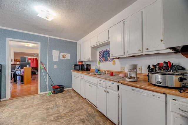 kitchen with white cabinetry, crown molding, white dishwasher, and a textured ceiling