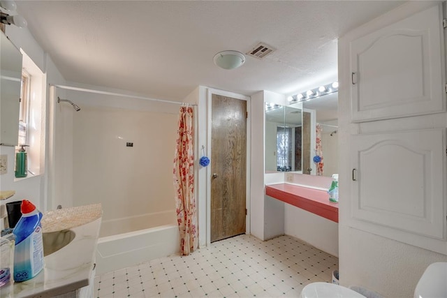 bathroom with toilet and shower / bath combo with shower curtain