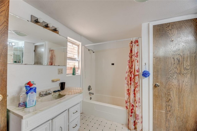 bathroom with vanity and shower / bath combo