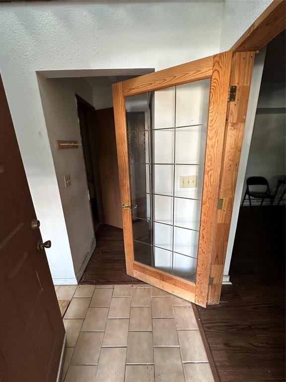 doorway to outside featuring tile patterned floors