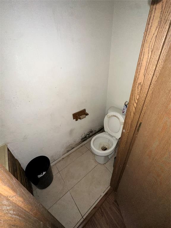 bathroom featuring tile patterned floors and toilet